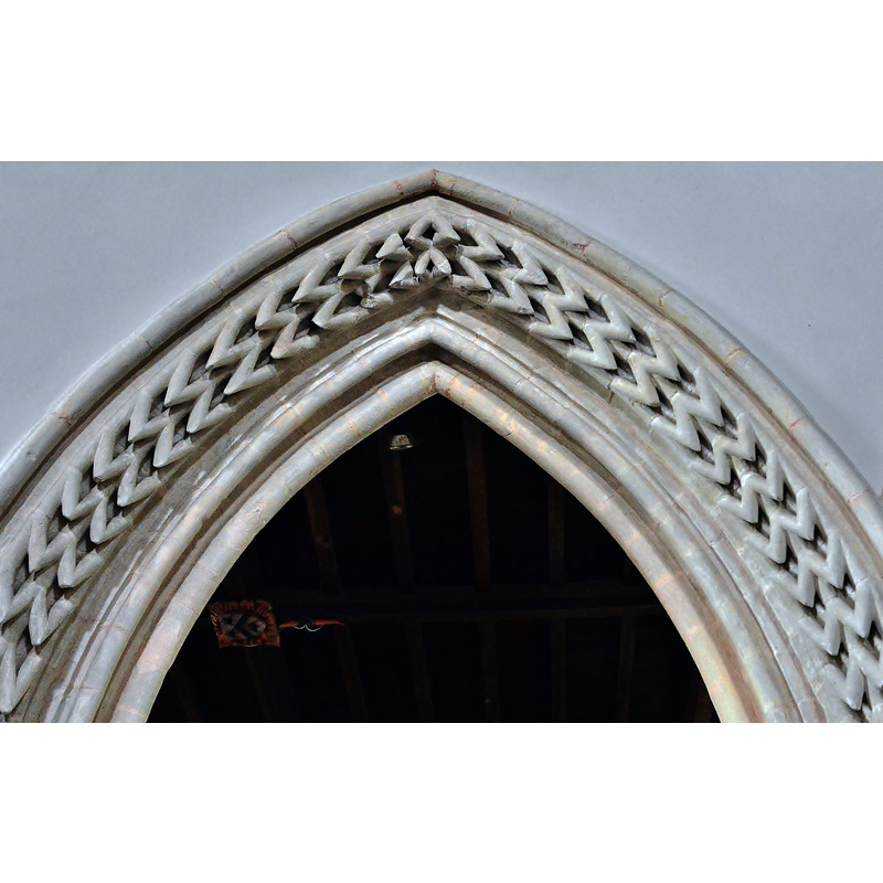 Source caption: "Whitchurch Canonicorum The Church of St Candida and Holy Cross. Unusual zig zag carving around one arch in the later north arcade."