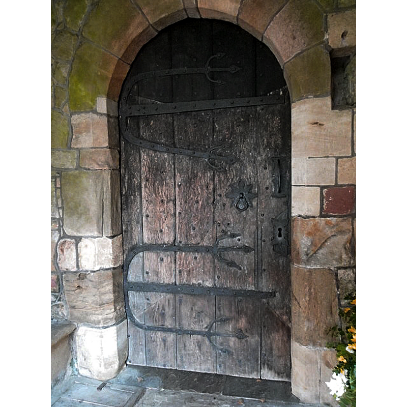 Source caption: "Door, All Saints Church. It is believed that the decorative iron hinges on the door date from the 12th century."