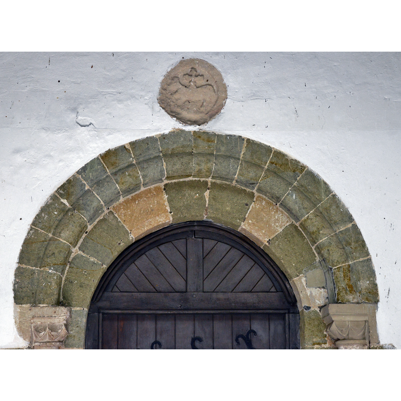 Source caption: "Breamore, St. Mary's Church: The c12th Lamb of God roundel in the south porch"