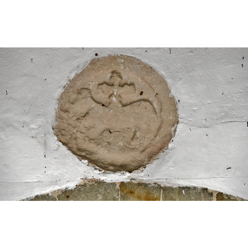 Source caption: "Breamore, St. Mary's Church: The c12th Lamb of God roundel in the south porch"