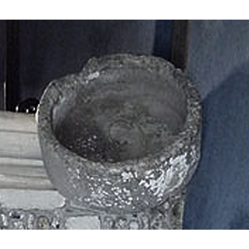 the much damaged and now disused stone basin of an old font [cf. FontNotes]