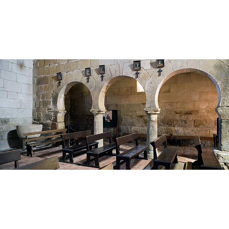 view of the west end of the nave and across into the north aisle, the northwest corner where the remains of the sunken font are located