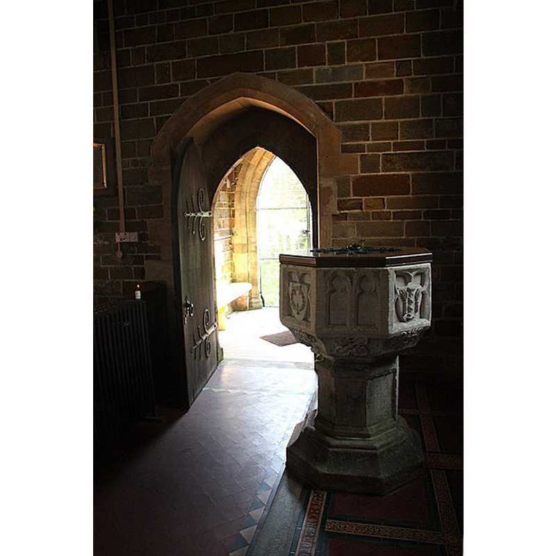 Source camtion: "An open south door illuminates the interior of St.Peter & St.Paul's church at Bratoft".