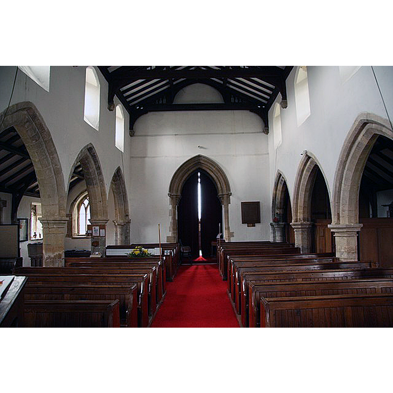 Source caption: "St.Andrew's nave. 13th century arcades and 19th century tower arch" -- the baptismal font is partially visible in the south [left] aisle, behind a pillar