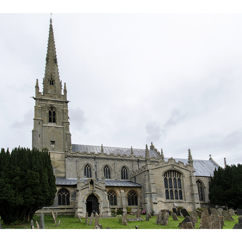 Source caption: "The church dates from circa 1300, and is built from ashlar with the lead roofs. The church is a cruciform plan with a west tower and spire, nave with north and south aisles, south porch, transepts, chancel and north vestry. The tower is of four stages, the two lower of circa 1300, the two upper of circa 1500. On the east side of the nave the original steeply pitched roofline is visible. The tower has ornate pinnacles and projecting gargoyles, the octagonal spire is 15th century with lucarnes, Crockets and finial. The nave has clerestory windows of three lights. There are moulded eaves with corbel heads above,and a frieze of shields, battlements and ornate pinnacles. The north aisle has an early 14th century west window and on the roof is a small bell turret,the north transept has early 14th century window of three lights. The chancel is 15th century and was restored in the 19th C. It has two large windows on both north and south sides each of three lights. There are hood moulds and grotesque animal label stops.There is a large pointed east window of five lights with perpendicular tracery. The original roofline of the chancel is visible on the east end of the nave. The south transept was probably remodelled in the 15th century from a detached lady Chapel built circa 1275. The west side of the transept has 14th century windows with head label stops. The porch is 14th century and has 15th century ornamentation, it has projecting gargoyles and ornate pinnacles. It contains stone benches and a corbel that once supported a roof, one is dated 1631. The 14th century west door has foliated capitals with elaborate finials. The nave has three bays, with piers from circa 1300. The south wall of the south transept has three 13th century sedilia and two aumbries. The chancel arch is from the 14th century and has caryatid figures. There is a 14th century screen which was restored in the 19th century. There is a 14th century hexagonal font with ornate Gables and pinnacles. The church contains various small 18th and 19th-century monuments. The church has recently undergone much restoration work including work to the spire, tower, bells, roof, windows and a new boiler system."