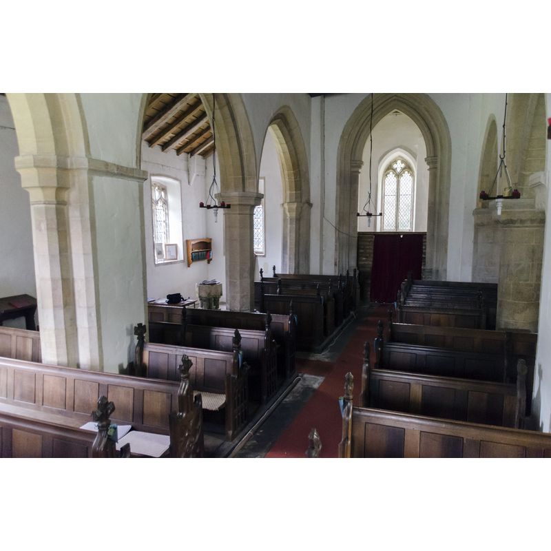 the reconstructed font is partially visible at the far [west] end of the south aisle
