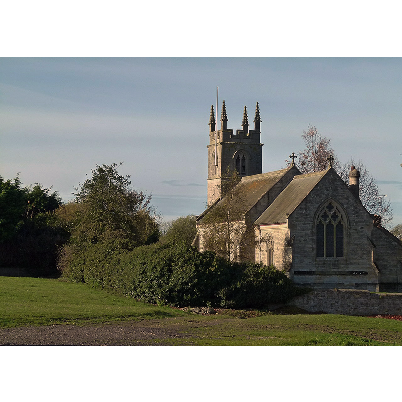 Source caption: "View from the south east, showing the east window with reticulated tracery. The church was essentially rebuilt completely in Decorated style in 1869, only the 15th century tower remaining of the medieval building."