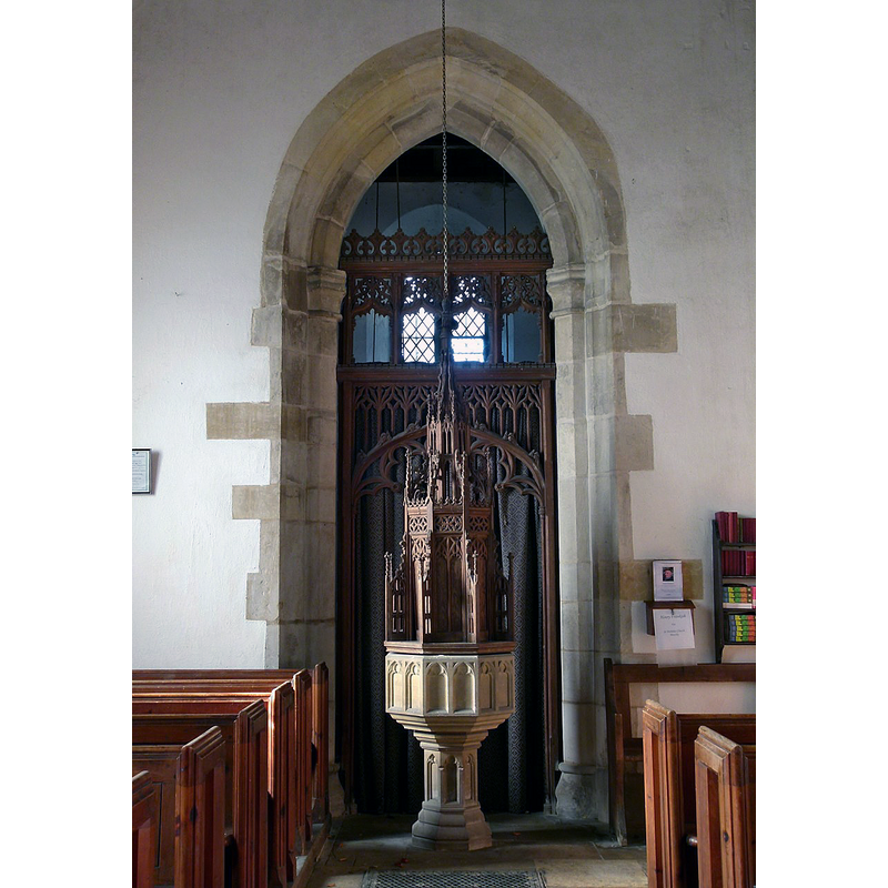 Source caption: "Church of St Nicholas, Gunby. Late 15th century Perpendicular tower arch with 19th century screen; 19th century font with elaborate cover. Screen and font cover are the work of the rev. W E Thorold and date from c.1880."