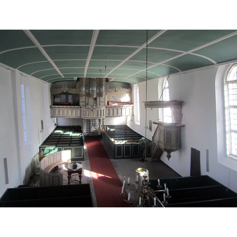the modern font stands near the pulpit, the focus of the Reformed church distribution