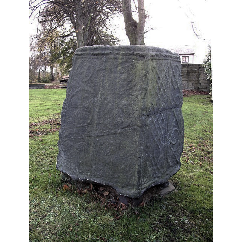 Source caption: "10th- or 11th-century base of an Anglian high cross in St Matthew's parish churchyard, Rastrick, West Yorkshire"