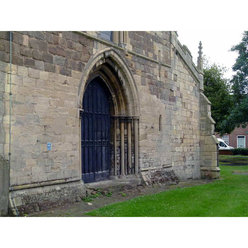 Source caption: "Church of St Lawrence, Snaith, west doorway. Dating from the construction of the tower in the 13th century."