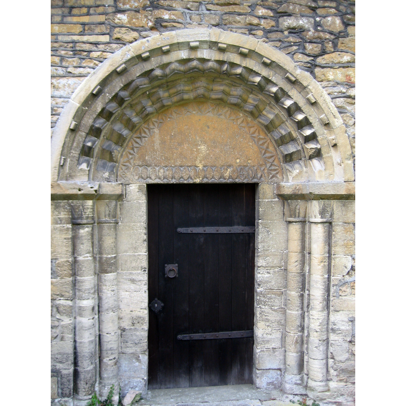 Source caption: "Norman north doorway of St Michael's parish church, Stanley Pontlarge, Gloucestershire, England".