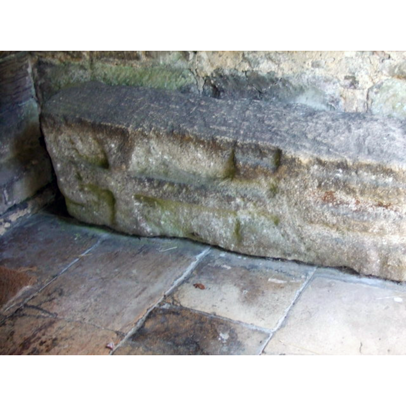 Source caption: "St. Oswald's church, Howell, Lincs. tombstone. This tombstone with a very clear cross marking, is said to date from the Anglo-Saxon period."