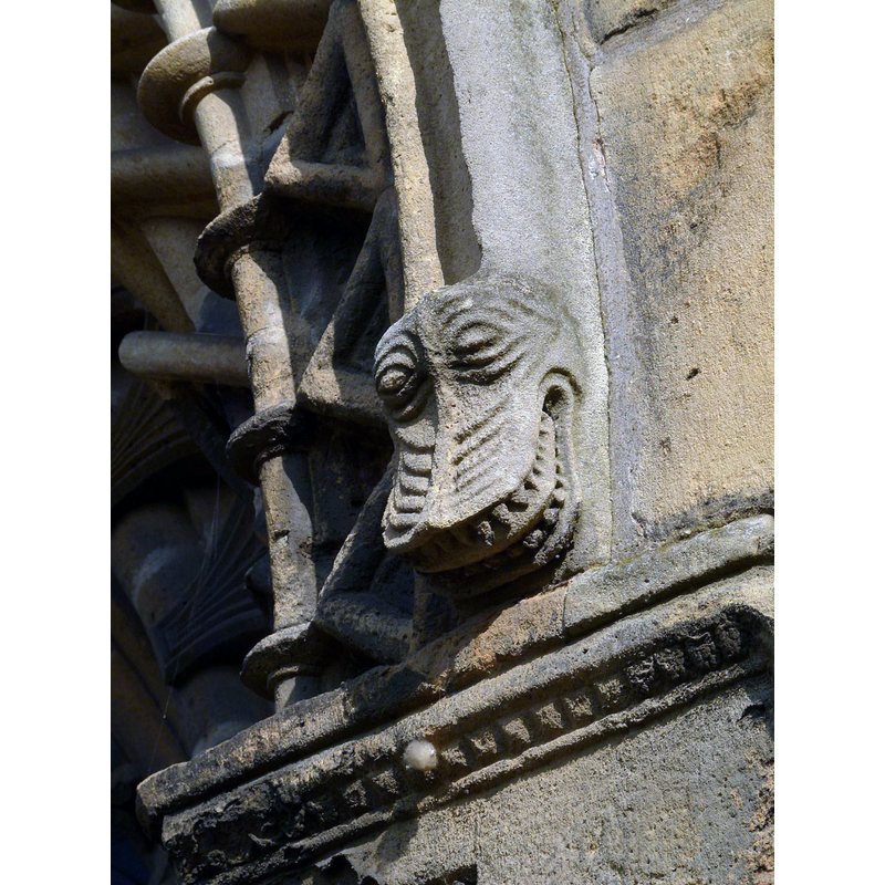 Source caption: "Corbel stop, west door, Worksop Priory. A typical Romanesque grotesque".
