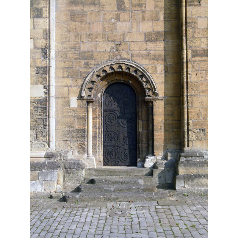 Source caption: "12th century doorway at the base of the north tower."
