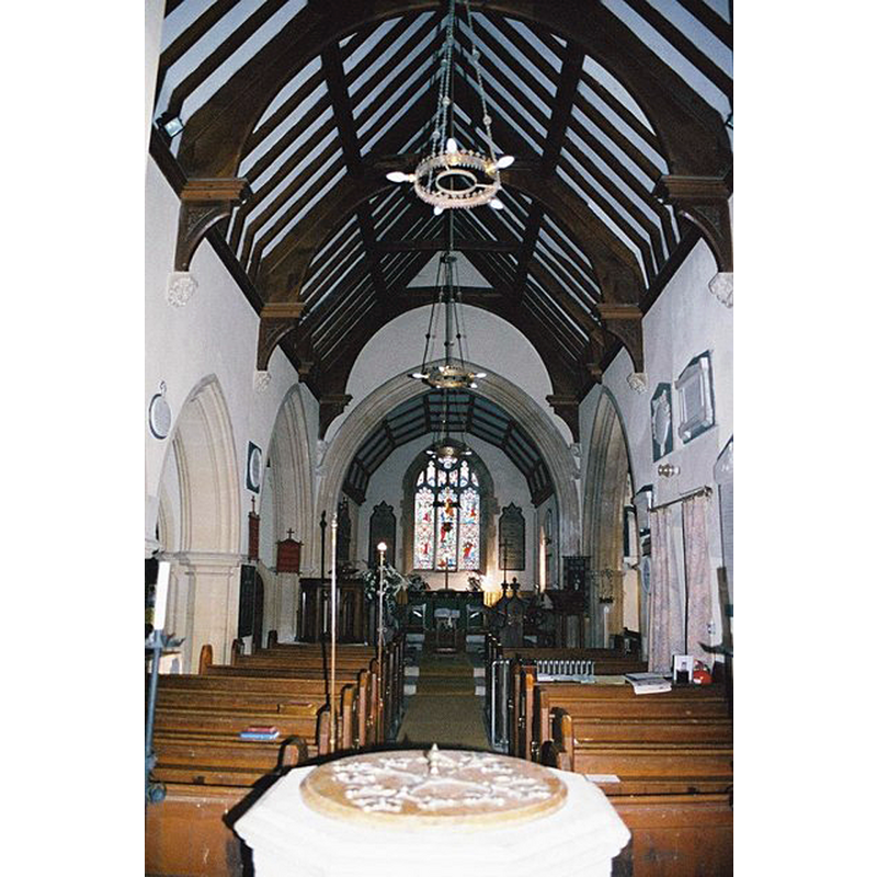 the top of the modern font seen here in the foreground of the mid-19thC nave