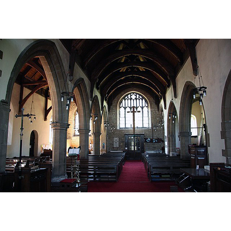 Source caption: "St.John's nave. The rapid population growth of Wales in the 19th century outgrew the small Norman church and two aisles were added to the south in 1897 forming a new nave, seen here looking west".