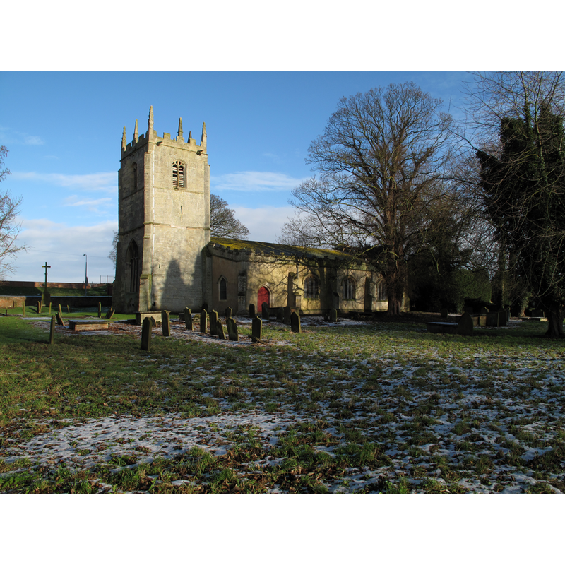 Source caption: "Church of St. Mary Magdalene at Whitgift. The S side of the church is seen here. The N side is unusual for having a clock with, in Roman numerals, thirteen at the top instead of twelve; explanations vary! Beyond the church, over a road, is the raised bank of the R[iver] Ouse".