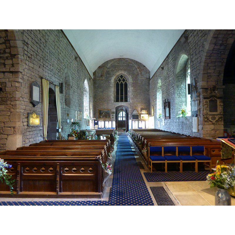 Source caption: "St Mary's church, Dymock, interior [...] There was originally a Saxon chapel on the site in the eighth century. Present church is from 11thC. onwards. The Tower was originally built over the chancel, but fell down fairly soon after being built. It was relocated to the west end. The remains of the arches can still be seen in the Crossing. It has a Spire with shingles. There is a north transept and sacristy. The nave is long, there are no aisles. South door has a Tympanum of the tree of life dating from Norman times. Like many churches, it was restored in the 19th Century."