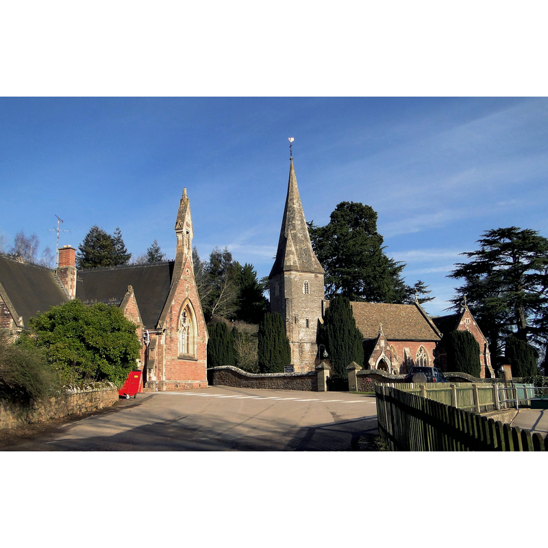 Source caption: "High Victorian pairing, Huntley. Teulon's magnificent village church of 1862-3 with its neighbour the National School of 1874-5, designed by Gloucester architect J.E. Jones. Both are still very much in use."