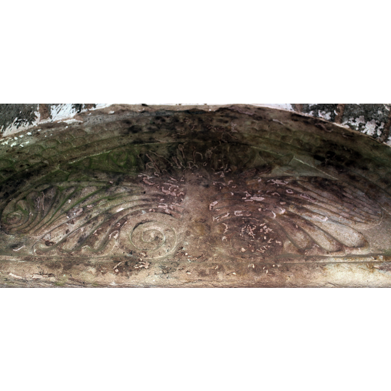 Source caption: "A "Tree of Life" design, said to be of the "Dymock School" of carving. Above the south doorway of the 12th century church. Difficult to photograph since the wooden porch was added in the 14th century."