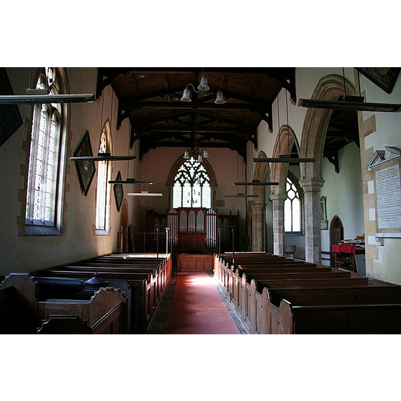 the old font is partially visible at the west end of the north aisle