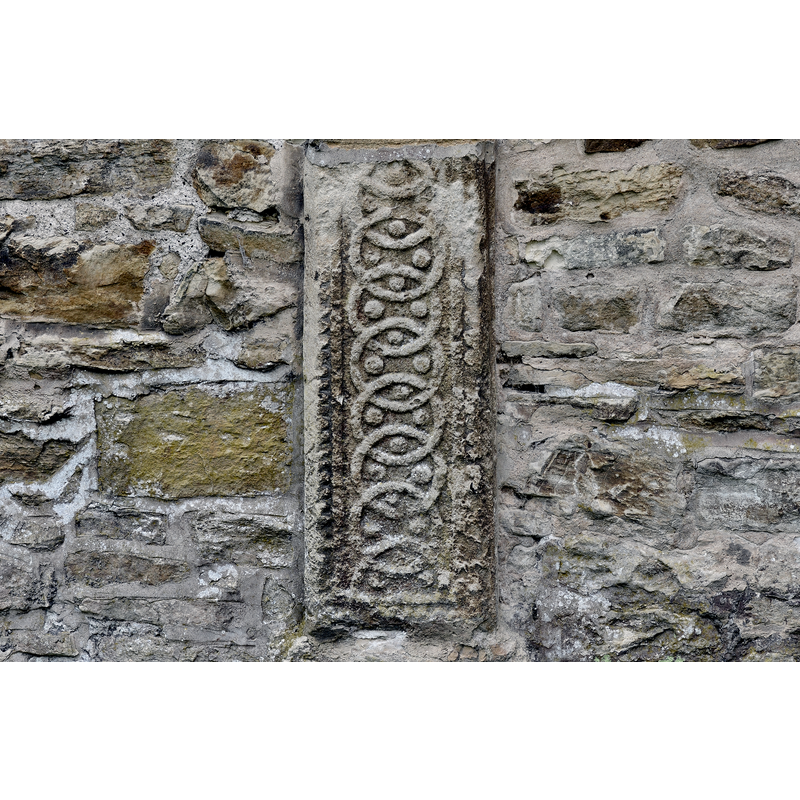 Source caption: "Bibury, St. Mary's Church: Saxon gravestone set into the north wall of the chancel".