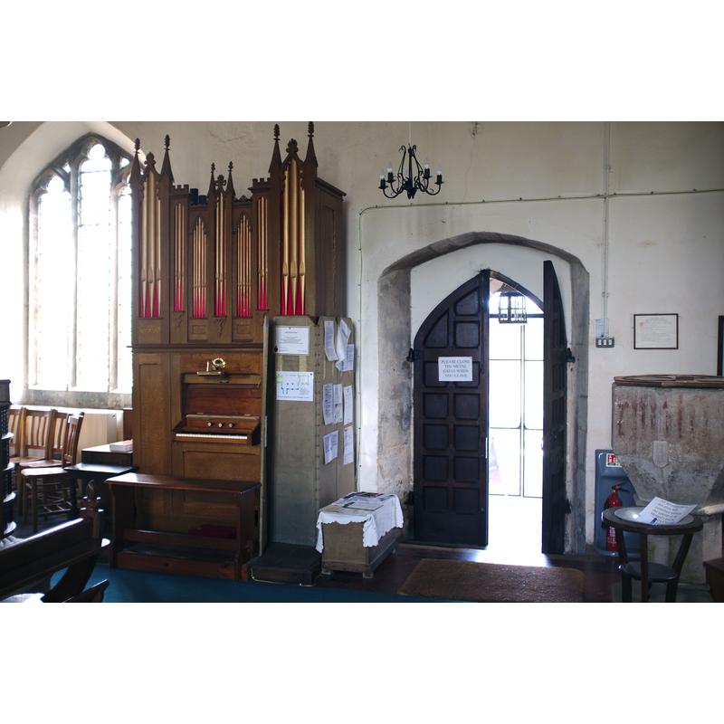 Source caption: "Church of St.Medard & St.Gildard: Main Entrance. The door from the porch, the Organ and the Font."