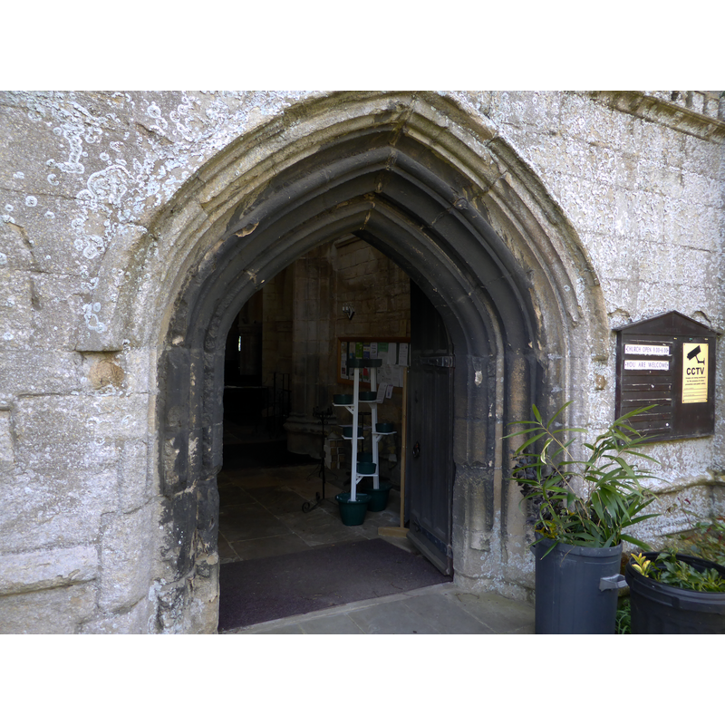Source caption: "Church of All Saints: The Doorway. The main entrance to the church is the West door, in the base of the tower."
