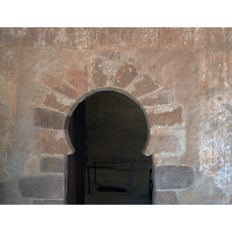 portal on the south wall, west side; date suggested in Arteguis [https://www.arteguias.com/ermita/sanmiguelgormaz.htm] [accessed 30 December 2018] in the 10thC: "situada en el extremo oeste del muro. Se trata de un valioso vano rematado por un arco de herradura muy cerrado con los salmeres redondeados y el dovelaje típico de lo califal del siglo X. Esta puerta estuvo cegada hasta la restauración acometida recientemente."