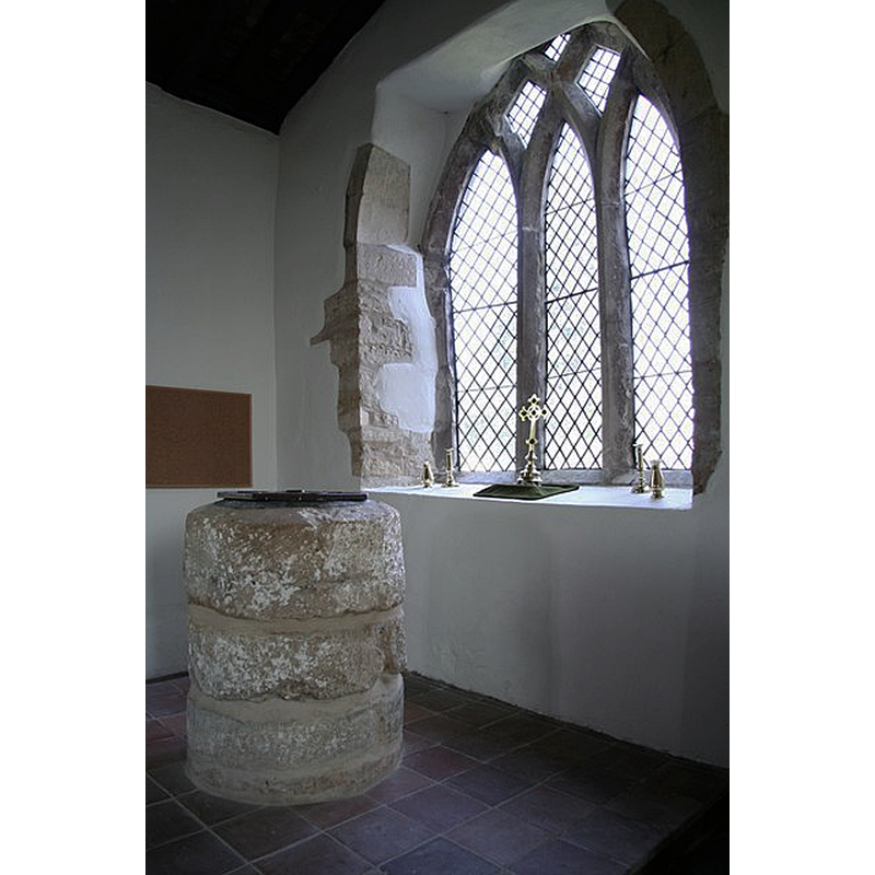 Source caption: "Humble Norman tub font of c1200 in the north aisle of St.Peter & St.Paul's church"