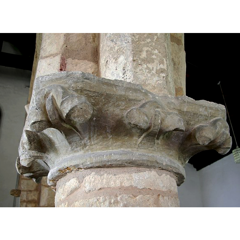 Source caption: "Crudely carved early stiff leaf capital of c1200 in the north arcade of St.Peter & St.Paul's church".