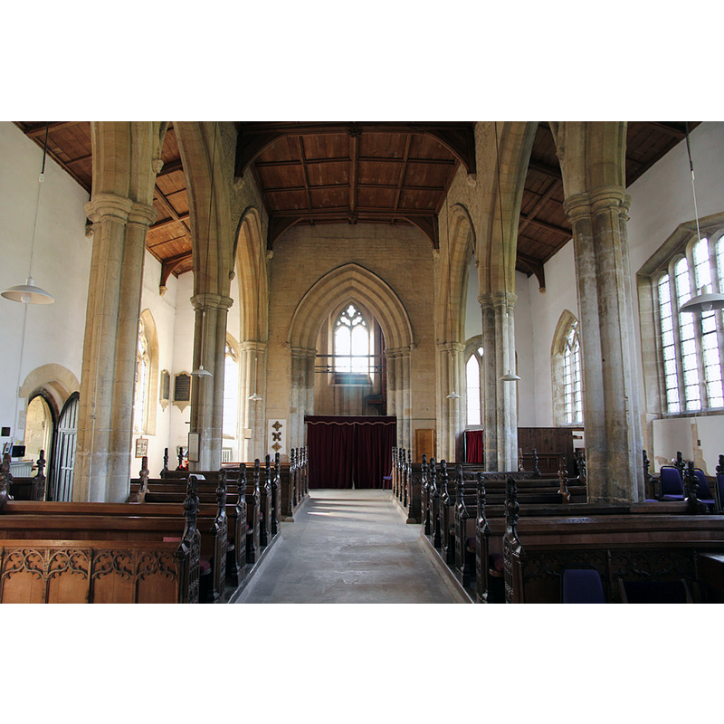 Source caption: "View west in St.Denis' nave, with tall 14th century arcades and tower arch".