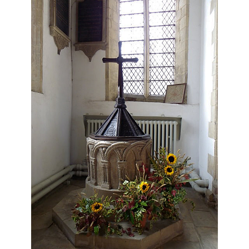 Source caption: "Font, The Church of St Denis. The font dates from the 12th century and the wooden lid dates from the 20th century."
