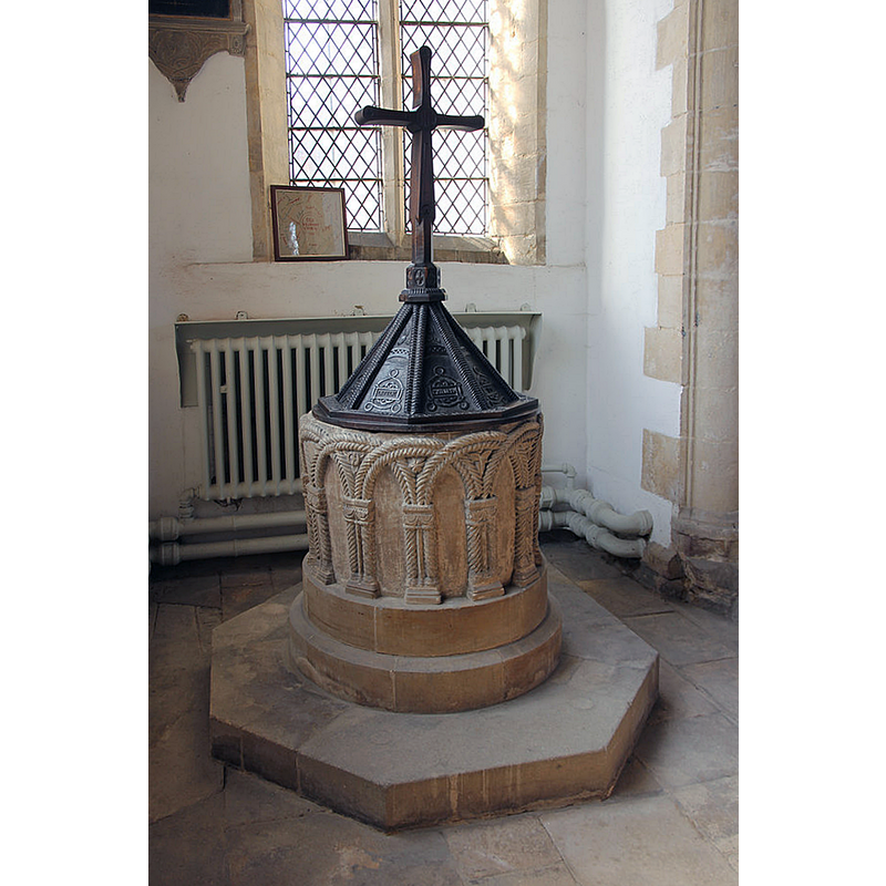 Source caption: "St.Denis' font. Splendid early 12th century tub font with two strand cabled interlacing blank arcading with cushion capitals".