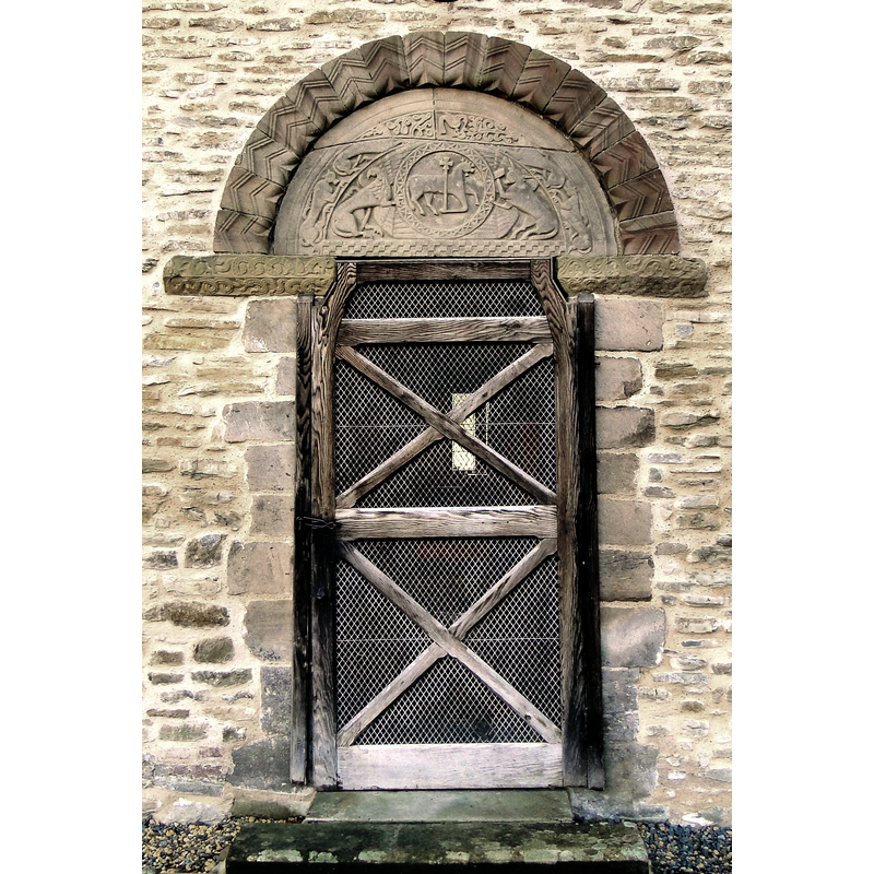 Source caption: "St Giles, Pipe Aston. The wonderfully preserved North door of this remote Norman church."