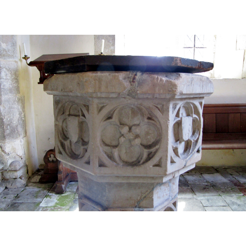 one of the petals damaged; notice also the damage at the upper rim where the metal staple has split the stone