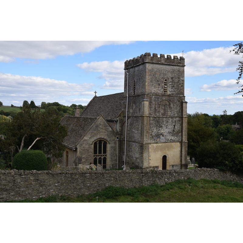 Source caption: "Chedworth Church (Saint Andrew), Gloucestershire, 7 September 2018. A 'wool' church: 12th Century Norman rebuilt in late 15th Century in Perpendicular style. Pictured is the west tower, the first three stages are Norman (note blocked-up former belfry windows), Perpendicular upper stage."