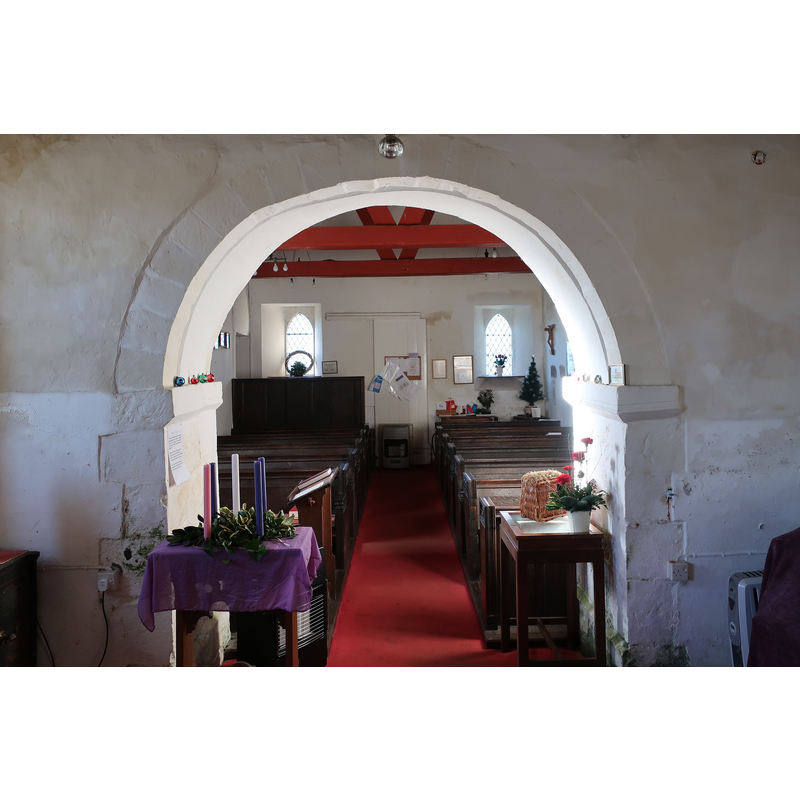 view from inside the chancel with a view of the 12thC arch