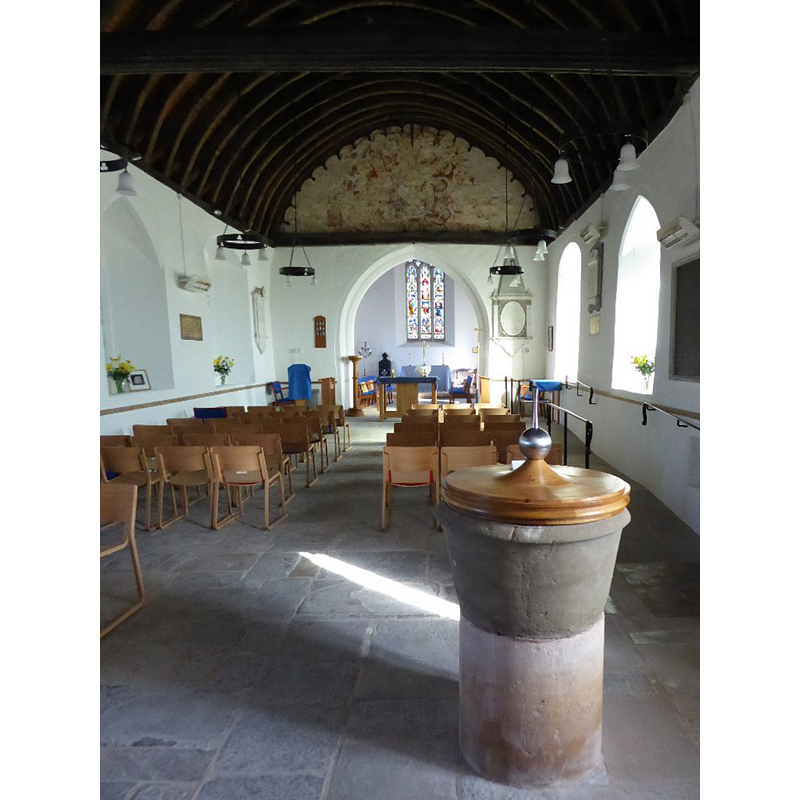with the font and cover in the foreground, south side -- Source caption: "The interior of Tirley church. In July 2007 Tirley church was hit by a devastating flood with water five feet deep in the nave of the church. Since then much restoration work has been carried out to the church, the most obvious change being the removal of the pews."