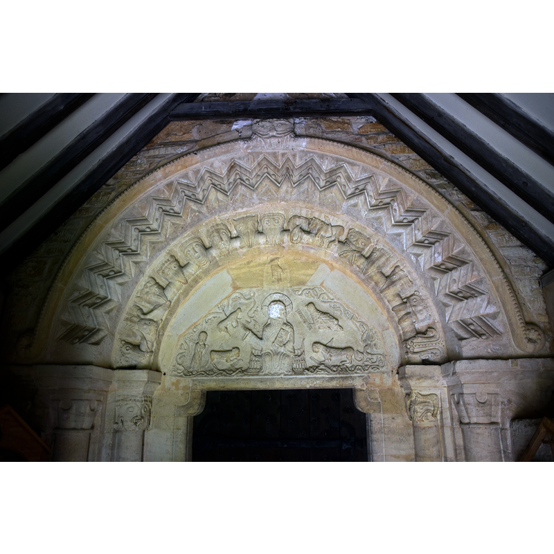 Source caption: "Pictured is the arch and tympanum, showing Christ in Majesty, of the Norman (1160) south doorway."