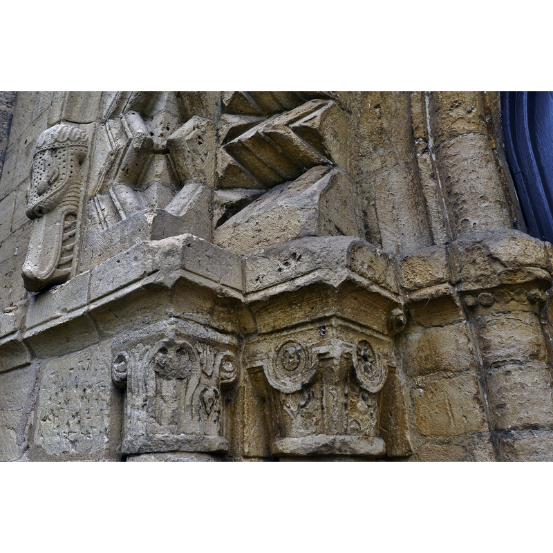Source caption: "Bishops Cleeve, St. Michael and All Angels Church: Norman west doorway capitals and serpent with vicious teeth".