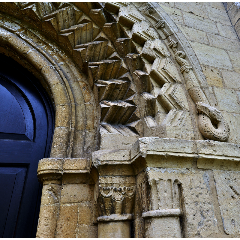 Source caption: "Bishops Cleeve, St. Michael and All Angels Church: Norman west doorway capitals and serpent eating itself".