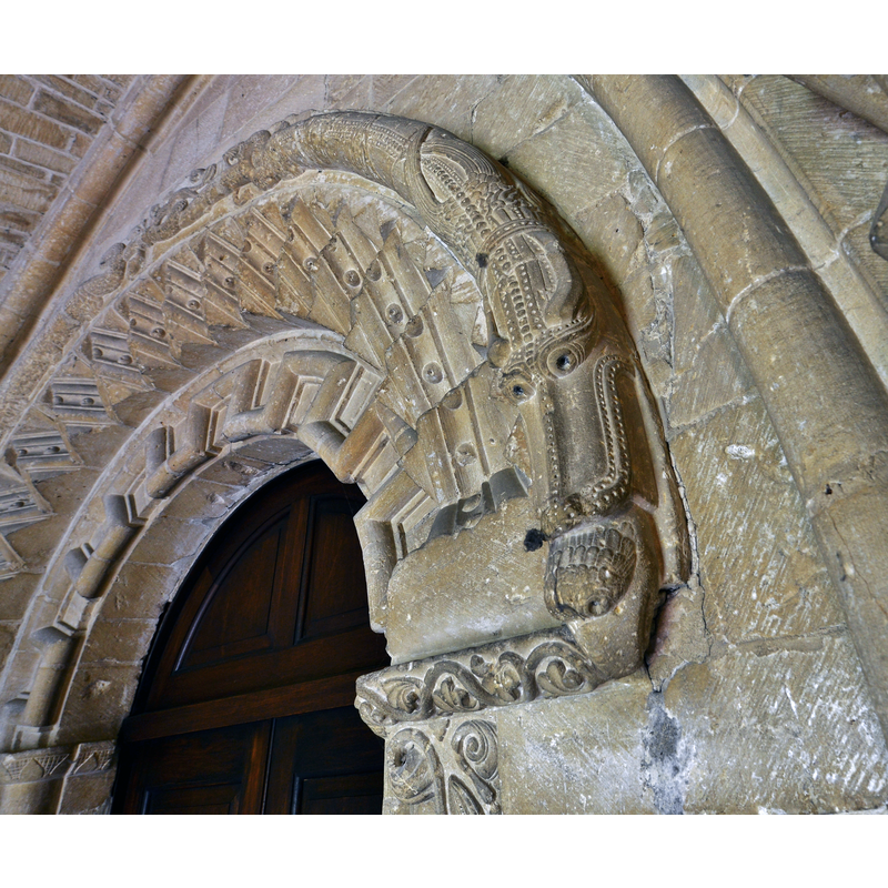 Source caption: "Bishops Cleeve, St. Michael and All Angels Church: Monster consuming another creature on the south doorway".