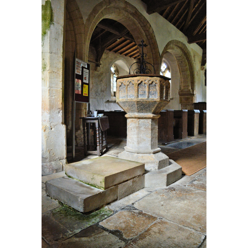 Source caption: "St John the Baptist, Oxenton. The 14th century font, with traces of original colour."
