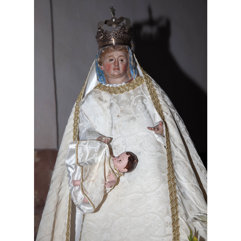 a unhappy Madonna carrying a doll-like Child on a string?