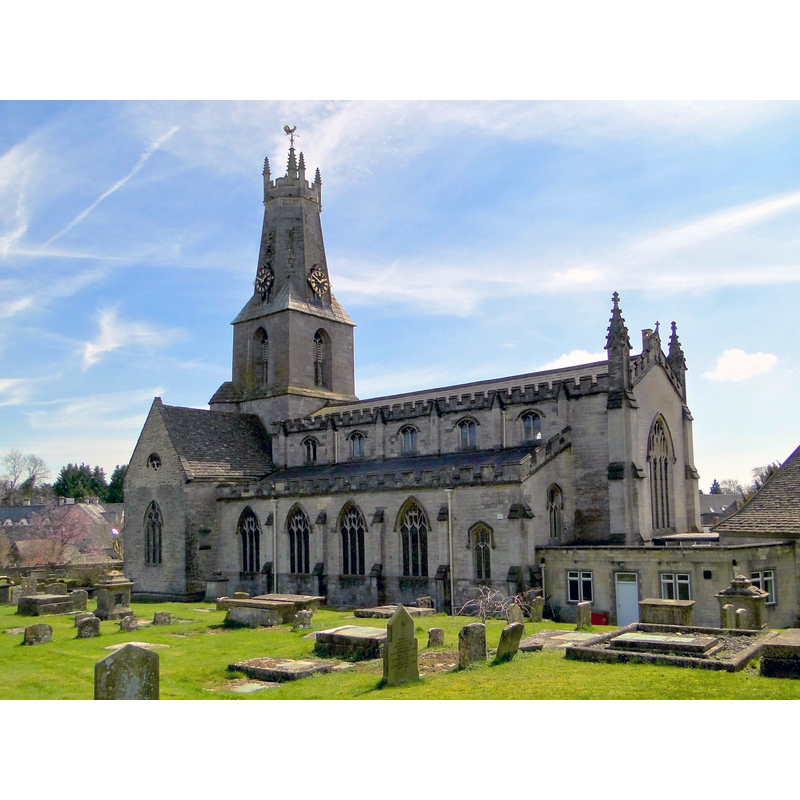 Source caption: "Holy Trinity, Minchinhampton. A major town church with Norman origins. Only the transepts and the tower are medieval, the nave being the work of Thomas Foster of Bristol, dating from 1841-3. Victorian, just, in date, but pre-Pugin in style. The unique spire top dates from 1563. The North side".