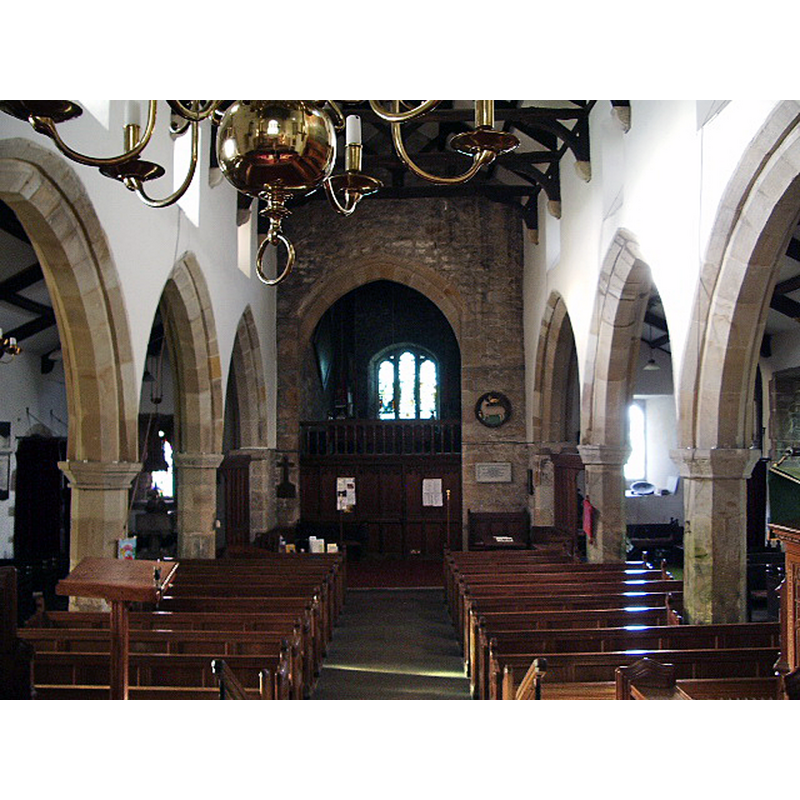 the modern font is discernible at the west end of the south aisle