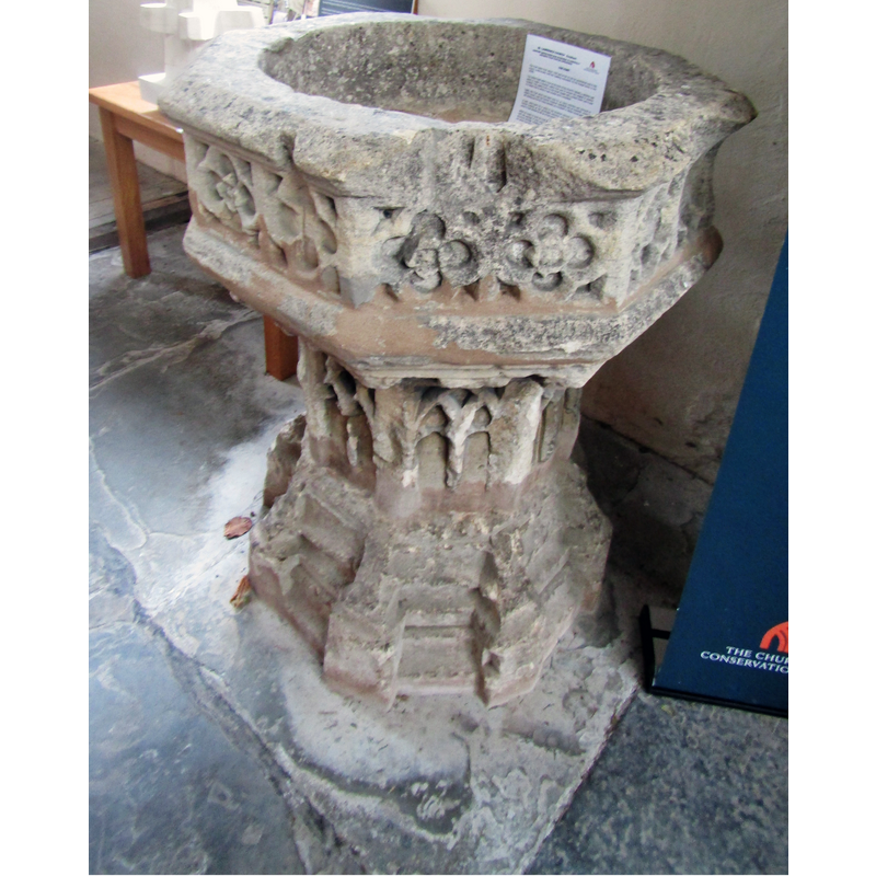 notice the damage to the upper rim and the weathering of the whole font
