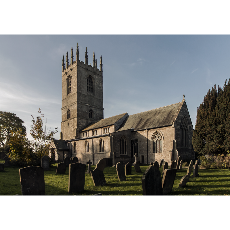 Source caption: "Founded around 1180, the south arcade was rebuilt in the 13th C. and other parts in the 14th C. The upper stage of the tower and 12 pinnacles were added in the 15th C. The church was restored in 1870 by Ewan Christian, but in 1901 there was a fire and the 15th C. rood screen was destroyed. The church was restored by Fowler. All the pre 1901 stained glass was replaced."